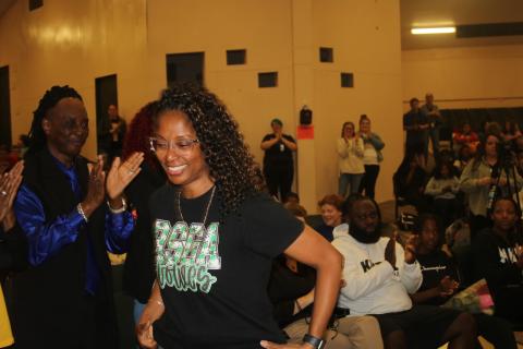 Richardson Sixth Grade Academy teacher Keisha Kimble was all smiles as she’s called up to receive a certificate from the district Friday for the statewide Excellence in Education award she received earlier in the week. (TONY BRITT/Lake City Reporter)