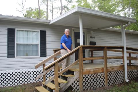 Columbia County Veterans Service Officer George Wehrli poses in front of the county’s new veterans  services office. (TONY BRITT/Lake City Reporter)