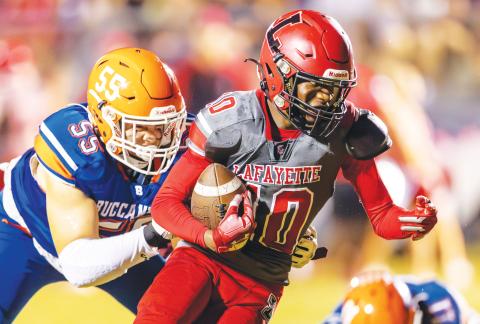 Lafayette receiver Jordan Murphy tries to escape a tackle from Branford defensive lineman Tate Dampier last Friday. (FILE)