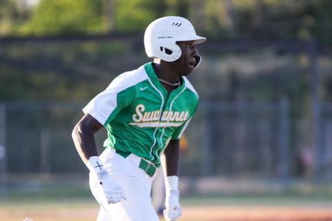 Suwannee right fielder PJ Davis races to first base after a hit against Rickards on Tuesday. (BRENT KUYKENDALL/Lake City Reporter)