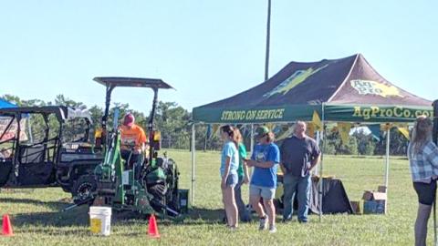 Kids Feeding Kids Ag Expo participants line up for a turn on some farm equipment during last weekend’s event. (COURTESY)