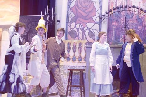 Fort White High School thespians Gracie Norman (from left), Mason Steele, Casey Dettman, Gracey Ayers and Juliette Torres, rehearse a scene for the school’s upcoming production of Beauty and The Beast. The production is the first musical in the school’s history and the first production in the school’s new performing arts center. (TONY BRITT/Lake City Reporter)