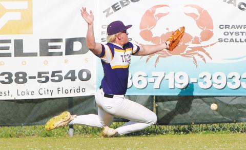 Columbia right fielder Max Schuler can’t catch up to a fly ball, which landed for a 2-RBI triple during an 11-0 loss to North Florida Christian on Tuesday. (JORDAN KROEGER/Lake City Reporter)