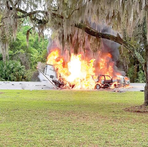 Two SUVs and a camper are engulfed in flames after a crash on State Road 136 near the State Farmer’s Market in White Springs on March 22. (COURTESY OF GLENN ALLEN)