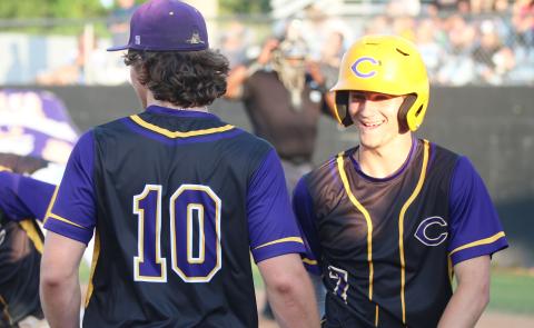 Columbia outfielder Bynton Edge (right) celebrates with Ayden Phillips after scoring a run against Chiles on April 17. The Tigers defeated IMG Academy 1-0 on Friday in extra innings after Edge hit a go-ahead RBI single in the eighth inning. (JORDAN KROEGER/Lake City Reporter)