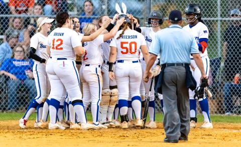 The Branford softball team greets center fielder Ellie Frierson (50) at home plate after she hit a home run against Lafayette on Friday. (JACK HOWDESHELL/Special to the Reporter)