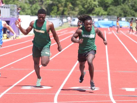 Suwannee runner Marquavious Owens won the 100m just ahead of teammate Michael Rossin at the Columbia High Jungle Open on Saturday. (PAUL BUCHANAN/Special to the Reporter)