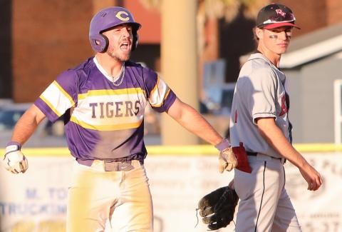 Columbia catcher Casen Maddox celebrates at second base next to Bishop Kenny second baseman Troy Ancayan after hitting a go-ahead 2-RBI double in the sixth inning of Friday’s 8-7 win. (BRENT KUYKENDALL/Lake City Reporter)