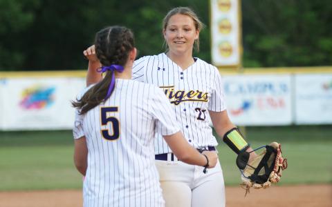 Columbia's Ava Christie (5) goes to hug pitcher Harleigh Price after Price threw a perfect game against Lincoln during Monday's District 2-5A quarterfinals. (JORDAN KROEGER/Lake City Reporter)