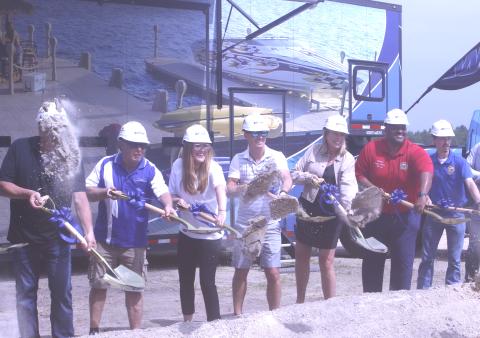 Wave Armor owner Rick Johanneck (second from left) and President Jennifer Johanneck-Eystad (third from left) toss shovels of dirt along with fellow Wave Armor representatives and Florida State Senator Corey Simon (right) during a groundbreaking ceremony Tuesday in Suwannee County. (JAMIE WACHTER/Lake City Reporter)
