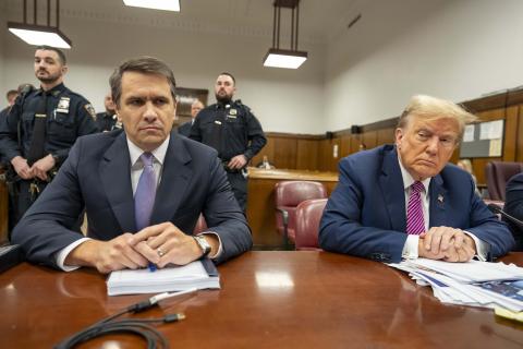 Former President Donald Trump (right) sits with his attorney Todd Blanche during his criminal trial as jury selection continues at Manhattan Criminal Court on Friday in New York City. (Mark Peterson/Pool/Getty Images/TNS)