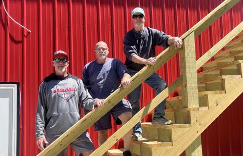Fort White head coach Rick Julius (from left), Vernon Masters, and Sean Boyle stand at the new press box/concession stand at the Josh Barton Field. (WENDY FRAZIER/Special to the Reporter)