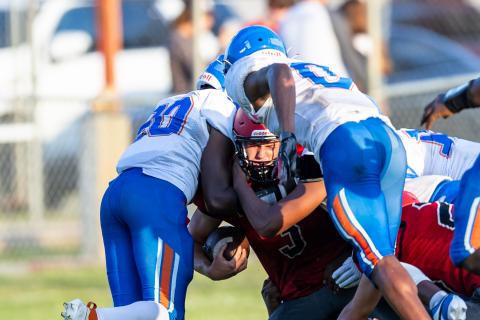 Lafayette running back Dayne McCray is tackled by a group of Taylor County defenders during Thursday's spring game. (JACK HOWDESHELL/Special to the Reporter)