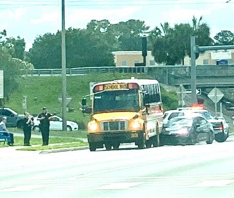 A Columbia County school bus sits on U.S. Highway 90 after it was rear-ended by a car Wednesday afternoon. No students were on board the bus at the time. (TODD WILSON/Lake City Reporter)