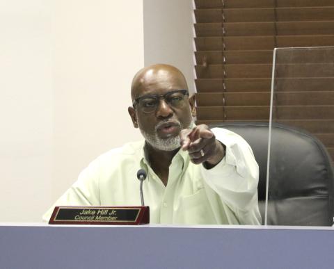 Councilman Jake Hill points toward Glenel Bowden during discussions Monday regarding city council raises. (MORGAN MCMULLEN/Lake City Reporter)
