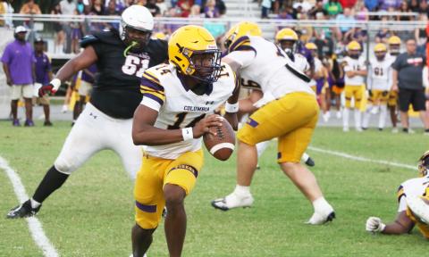 Columbia quarterback Xavier Collins scrambles out of the pocket during Friday’s spring game against Fort White. (MORGAN MCMULLEN/Lake City Reporter)