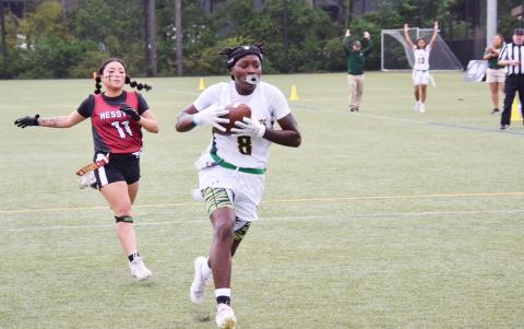 FGC receiver Alexandra Harris runs past Hesston College’s Destiny Ortiz for a touchdown during Game 1 of the NJCAA National Championship series on Wednesday. (COURTESY OF FGC)