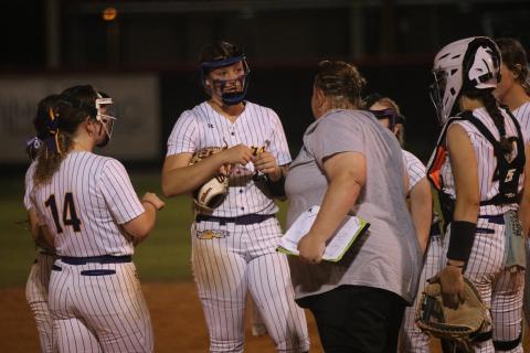 Columbia coach Cindy Dansby meets with pitcher Harleigh Price after Middleburg took a 2-1 lead in the sixth inning of Thursday's Region 1-5A quarterfinal. (JORDAN KROEGER/Lake City Reporter)