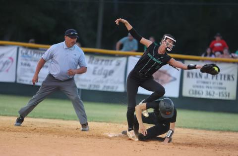 West Nassau’s Lauren Rosepiler beats a throw to Suwannee shortstop Rachel Smith at second base during Wednesday’s Region 1-3A quarterfinal. (PAUL BUCHANAN/Special to the Reporter)
