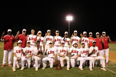 The Lafayette Hornets pose with the District 6-1A championship trophy after defeating Union County 2-1 on Thursday. (COURTESY)