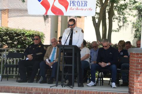 Lake City Fire Chief Josh Wehinger addresses the crowd as local and religious leaders listen during Thursday’s National Day of Prayer. (MORGAN MCMULLEN/Lake City Reporter)