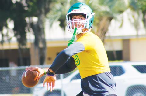 Suwannee quarterback Thomas Sikes drops back to pass during Monday’s practice. (JAMIE WACHER/Lake City Reporter)