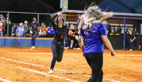 Branford third baseman Madyson Sikes celebrates running to first base after hitting a walk-off home run to defeat Fort White in the Region 3-1A championship on Tuesday. (BRENT KUYKENDALL/Lake City Reporter)