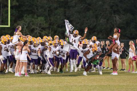 Columbia's football team takes the field prior to a game against Ridgeview last season. (BRENT KUYKENDALL/Lake City Reporter)