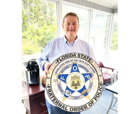 Lake City’s Koby Adams, a legislative assistant to Dist. 12 State Rep. Wyman Duggan of Jacksonville, was honored as 2024 Legislative Aide of the Year by the Florida State Fraternal Order of Police during the group’s annual convention this week in Orlando. (TODD WILSON/Lake City Reporter)