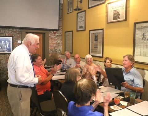 Mayor Stephen Witt delivers a speech during Keith Williams’ retirement party Thursday at Marion Street Bistro. Witt also provided Williams with a proclamation celebrating his years of service. (MORGAN MCMULLEN/Lake City Reporter)