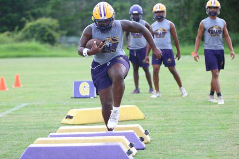 Columbia running back Johnathan Andrews runs through a drill during Monday's practice. (JORDAN KROEGER/Lake City Reporter)