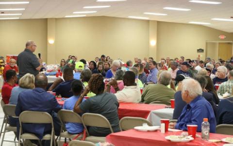 Columbia County Commissioner Rocky Ford (standing, left) speaks at the 2022 GOP candidate rally at the Columbia County Fairgrounds. (FILE)