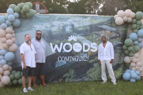 Jimbo Haley (from left) visits with James Crenshaw and Michael Woods, president and CEO of The Woods, about the opening of the unique outdoor venue. (TONY BRITT/Lake City Reporter)