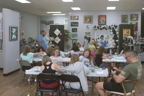 Area youngsters and some of their parents take part in the Young daVinci Summer Art Camp at the Gateway Art Gallery. This year’s camp was funded through a grant from Clay Electric and had 20 children attend the three-day camp. (TONY BRITT/Lake City Reporter)