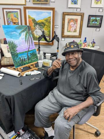 R.L. Lewis, an original Florida Highwaymen artist, demonstrated his artistic style at the Gateway Art Gallery on Saturday. (COURTESY)