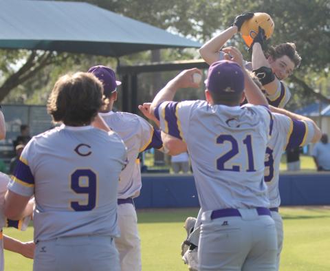Columbia High’s Ayden Phillips celebrates with teammates after hitting a two-run home run against The Villages Charter this past spring. (FILE)
