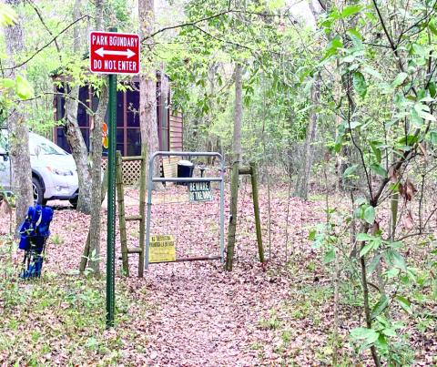 A gate into Rum Island Park from a neighboring property that stands in place of a county fence, which Columbia County officials say was cut to provide free access into the park. (FILE)