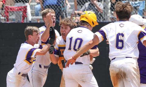 Columbia’s Ayden Phillips hugs Josh Fernald (10) at home plate after Fernald hit a walk-off grand slam against Lincoln in the Region 1-5A semifinals on May 12, 2023. (FILE)