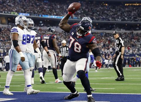 Houston Texans offensive tackle Laremy Tunsil (78) spikes the football after following his team’s touchdown against the Dallas Cowboys at AT&T Stadium on Dec. 11, 2022, in Arlington, Tex. (TOM FOX/TNS)