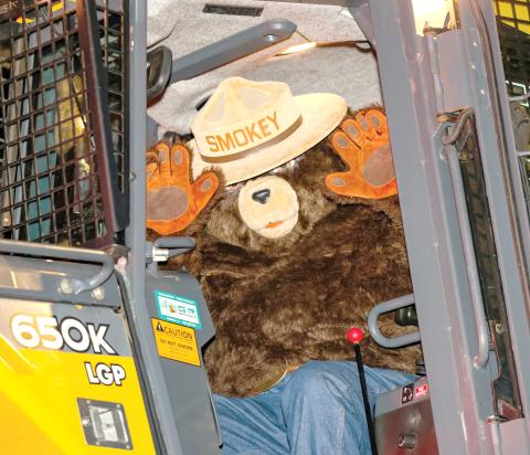 Smokey Bear, waving during the Lafayette County Christmas parade last winter, will be celebrating his 80th birthday at Alligator Lake Park on Saturday. (JACK HOWDESHELL/Special to the Reporter)