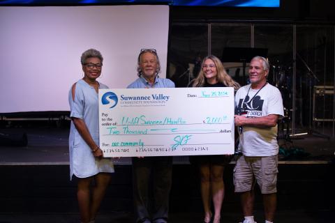 Kecia Robinson with the Suwannee Valley Community Foundation (from left) provides a check for $2,000 to Uplift Suwannee and Hamilton counties to Dusty Pye with LSF Health Systems, Chrissy Polovich with Mountain2Sea Ministries and Greg Player with Recovery Church. (COURTESY)