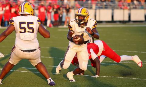 Columbia quarterback Zamarion Jones escapes a sack and scrambles up the field against Bradford during Friday’s Preseason Classic. (BRENT KUYKENDALL/Lake City Reporter)