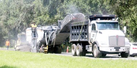 Crews from Anderson Columbia work Wednesday on resurfacing U.S. Highway 41 in southern Columbia County. The first layer of the project is nearly complete but the whole resurfacing and improvements is expected to last until next summer. (TONY BRITT/Lake City Reporter)