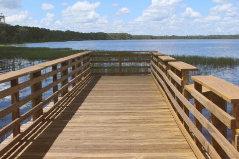 The wooden pier at the Olustee Beach Day Use Area boat ramp in the Osceola National Forest was recently refurbished and rehabilitated, providing a safer environment for fishing. (TONY BRITT/Lake City Reporter)