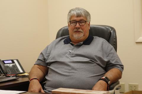 Keith Couey, pictured sitting in his office at the Columbia County School District administration building as he transitions into becoming the district’s superintendent in November, aims to remain visible at school sites. (JAMIE WACHTER/Lake City Reporter)
