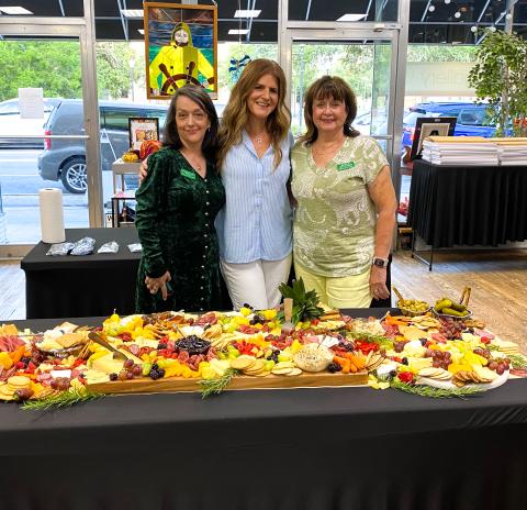 Sheila Carr (from left), curator of the Gateway Art Gallery stands with Abbie Chasteen Rosner, owner of  All Things Abbie, and Jeanne Van Arsdall, chairman of the Gateway Art Gallery’s 10th anniversary celebration and creator of the Charcuterie and Chardonnay fundraiser event. Konnie Patke (not pictured), director of the Tourist Development Agency, was the wine sommelier for the event. (COURTESY)