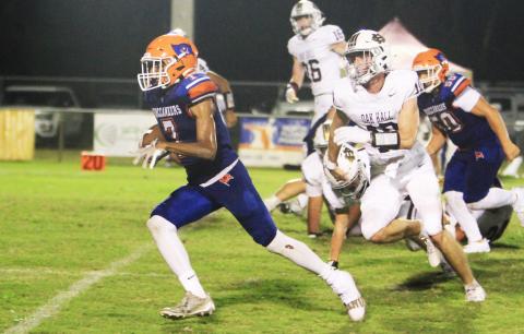 Branford receiver Ar’kayvion Jones runs past the Oak Hall defense last Friday. (PAUL BUCHANAN/Lake City Reporter)