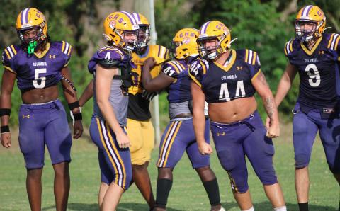 Columbia defensive lineman Caden Bolstein (44) celebrates after making a tackle alongside teammates Jalen Gaskins (5), Ayden Phillips (4) and Kyten Davis (9) during Wednesday’s practice. (JORDAN KROEGER/Lake City Reporter)