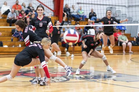 Lafayette senior Kiley Beach (8) reacts to her block of Williston middle hitter Kai Gowland (9) during Thursday's match. (JACK HOWDESHELL/Lake City Reporter) 