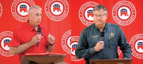 Wallace Kitchings (left) and Mark Hunter, candidates for Columbia County sheriff, speak to voters on Thursday at the Columbia County Republican Party's political rally at the Florida Gateway Fairgrounds. (Photos by JAMIE WACHTER/Lake City Reporter)